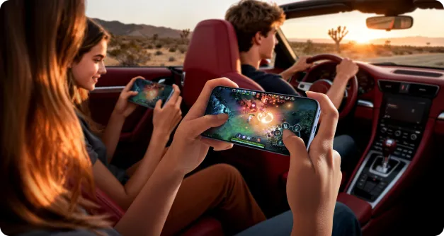 Młodzi ludzie na tylnym siedzeniu samochodu grający na smartfonach podczas podróży