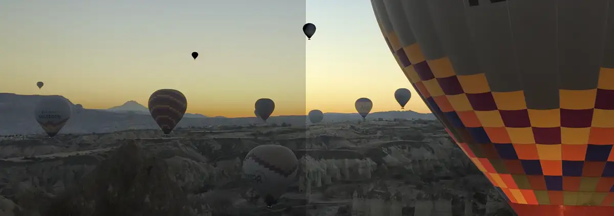 Balony lecące o zachodzie słońca nad skalistym krajobrazem