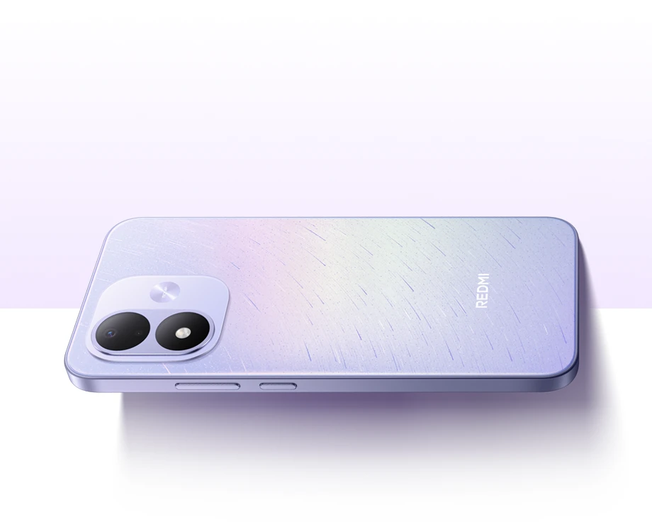 Fioletowy smartfon REDMI leżący tyłem do góry, z widocznym podwójnym aparatem
