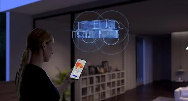 Zdjęcie kobiety, która na smartfonie konfiguruje ustawienia routera