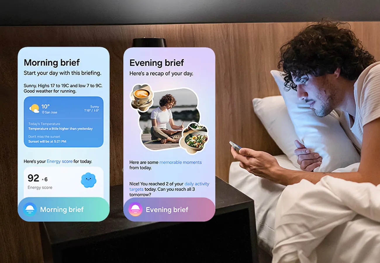 Mężczyzna leży w łóżku i patrzy na ekran telefonu z podsumowaniem dnia w aplikacji Galaxy AI
